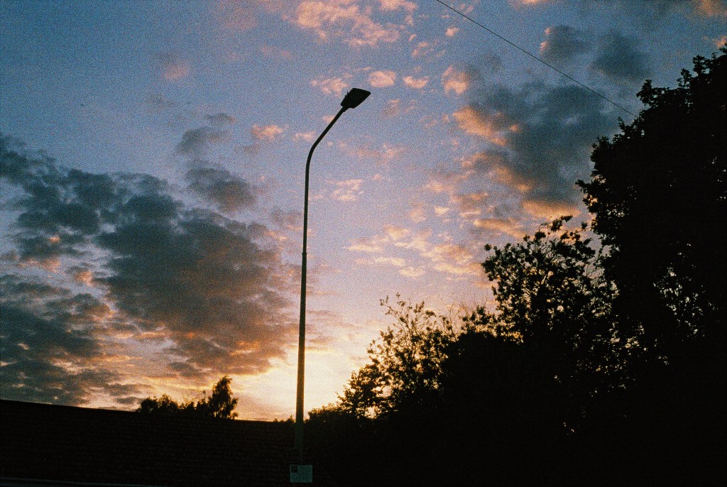 Halesworth. Summer setting sun over rooftops.